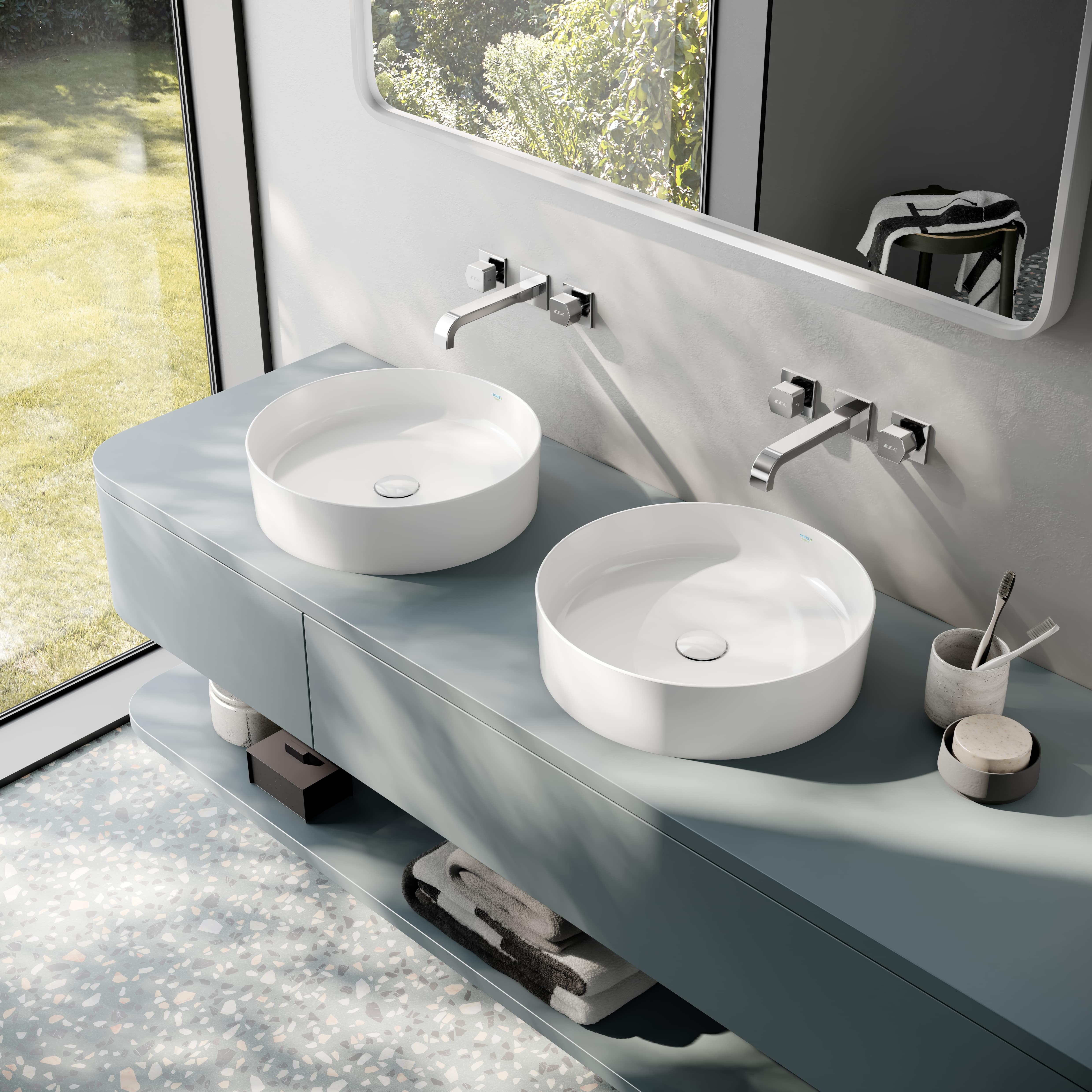 Modern bathroom with elegant basin and wall-mounted faucets